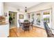Bright dining room featuring hardwood floors and glass patio doors at 6964 S Olive Way, Centennial, CO 80112