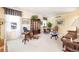 Spacious living room featuring stylish decor, natural light, and comfortable seating at 6964 S Olive Way, Centennial, CO 80112
