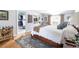 Cozy main bedroom showing walk-in closet and relaxing sitting area at 6964 S Olive Way, Centennial, CO 80112