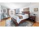 Bright main bedroom features a large bed, natural light, and stylish furnishings at 6964 S Olive Way, Centennial, CO 80112