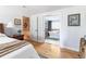 Comfortable main bedroom with ensuite bathroom and view of soaking tub at 6964 S Olive Way, Centennial, CO 80112