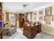 Home office with hardwood desk, built-in cabinets and decor at 6964 S Olive Way, Centennial, CO 80112