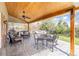 Outdoor patio area with wooden ceiling and outdoor dining furniture at 6964 S Olive Way, Centennial, CO 80112