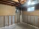 Unfinished basement with exposed studs and concrete foundation walls at 598 Toledo St, Aurora, CO 80011