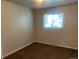 Bedroom featuring carpet flooring, neutral walls, and natural lighting at 598 Toledo St, Aurora, CO 80011