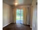 Bedroom featuring sliding glass doors and carpet flooring at 598 Toledo St, Aurora, CO 80011