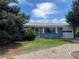 Charming blue brick home with a well-maintained yard and attached garage at 598 Toledo St, Aurora, CO 80011