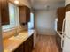 Bright kitchen with a double sink, wood cabinets, and modern lighting at 598 Toledo St, Aurora, CO 80011