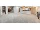 Expansive basement offers a flexible layout with carpeting, a bar area, and room for activities at 1007 Thorncreek Ct, Thornton, CO 80241