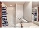 Bathroom features a shower, toilet, and large mirror at 1007 Thorncreek Ct, Thornton, CO 80241