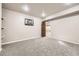 Bedroom with gray carpeted floor, light colored walls, and an open door at 1007 Thorncreek Ct, Thornton, CO 80241