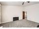 Spacious bedroom featuring plush gray carpeting and an ensuite bathroom entrance at 1007 Thorncreek Ct, Thornton, CO 80241
