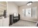 Neutral bedroom offers ample natural light from a window and features soft carpeted floors at 1007 Thorncreek Ct, Thornton, CO 80241