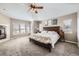 Spacious bedroom boasts a ceiling fan, ample windows, and neutral decor at 1007 Thorncreek Ct, Thornton, CO 80241