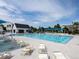 Community pool with ample lounge chairs and shade at 1007 Thorncreek Ct, Thornton, CO 80241