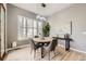 Bright breakfast nook with ample natural light, a round table, and comfortable seating at 1007 Thorncreek Ct, Thornton, CO 80241