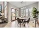 Casual dining area featuring an adjacent door to outdoor living, and light wood floors at 1007 Thorncreek Ct, Thornton, CO 80241