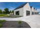 Modern community clubhouse with sleek design, dark trim, large windows and professional landscaping at 1007 Thorncreek Ct, Thornton, CO 80241