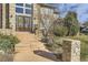 Inviting front entrance features a decorative door with sidelights and stone pillars at 1007 Thorncreek Ct, Thornton, CO 80241