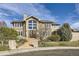 Stunning two-story home boasts stone accents, a grand entrance, and professional landscaping at 1007 Thorncreek Ct, Thornton, CO 80241