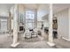 Open floor plan features a large living room with fireplace and soaring vaulted ceilings at 1007 Thorncreek Ct, Thornton, CO 80241