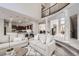 Open floorplan with living room, kitchen, and entry offering ideal space for entertaining at 1007 Thorncreek Ct, Thornton, CO 80241