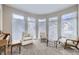 Bright sitting room features a bay of windows and neutral colored walls at 1007 Thorncreek Ct, Thornton, CO 80241