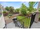 Private backyard featuring a lush lawn, garden beds, a grill, and a wooden privacy fence at 9468 E Aspen Hill Ln, Lone Tree, CO 80124