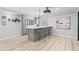 Finished basement bar with seating, stylish pendant lights, and movie decor at 9468 E Aspen Hill Ln, Lone Tree, CO 80124
