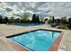 Inviting community pools featuring a kiddie pool, lifeguard stand, and surrounding recreational area at 9468 E Aspen Hill Ln, Lone Tree, CO 80124