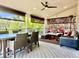 Relaxing covered deck with ample seating, a ceiling fan, and stylish decor for outdoor comfort at 9468 E Aspen Hill Ln, Lone Tree, CO 80124