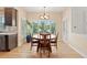 Dining room features a round table with seating for four and plantation shutters on the windows at 9468 E Aspen Hill Ln, Lone Tree, CO 80124