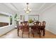 Formal dining room with coffered ceiling, hardwood floors, and natural lighting at 9468 E Aspen Hill Ln, Lone Tree, CO 80124