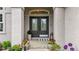 Elegant entryway with a double front door, potted plants and tiled floor at 9468 E Aspen Hill Ln, Lone Tree, CO 80124