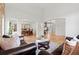 Open-concept layout showcasing the living room, dining area, and staircase at 9468 E Aspen Hill Ln, Lone Tree, CO 80124