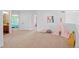Second-floor loft area showcases carpet, a colorful teepee, natural light, and easy access to bedrooms and other spaces at 9468 E Aspen Hill Ln, Lone Tree, CO 80124