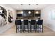 Entertainers bar with black bar stools and stylish decor at 6008 Long Branch Dr, Parker, CO 80134