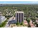 Wide aerial shot of condo building showing its proximity to neighborhood and mature landscaping at 3131 E Alameda Ave # 803, Denver, CO 80209