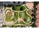 Aerial view of manicured community gardens featuring tennis courts and lush landscaping at 3131 E Alameda Ave # 803, Denver, CO 80209