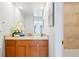 Updated bathroom showcases a modern vanity with stone countertop and decorative accents at 3131 E Alameda Ave # 803, Denver, CO 80209