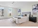 Serene bedroom with large windows offers natural light and beautiful city views at 3131 E Alameda Ave # 803, Denver, CO 80209