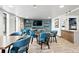 Modern dining area featuring a television, modern lighting, and multiple seating options at 3131 E Alameda Ave # 803, Denver, CO 80209