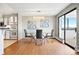 Modern dining room with contemporary furnishings and floor to ceiling sliding glass door at 3131 E Alameda Ave # 803, Denver, CO 80209