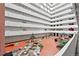 Stunning view of the bright and airy interior atrium featuring koi ponds and lush greenery at 3131 E Alameda Ave # 803, Denver, CO 80209