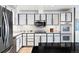Contemporary kitchen with stainless steel appliances and white cabinets and countertops at 3131 E Alameda Ave # 803, Denver, CO 80209