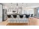 Bright kitchen boasts white cabinets, stainless steel appliances, and a convenient breakfast bar at 3131 E Alameda Ave # 803, Denver, CO 80209