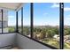 Bright sunroom filled with natural light through a wall of windows and lovely views of the community at 3131 E Alameda Ave # 803, Denver, CO 80209