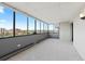 Bright sunroom filled with natural light through a wall of windows with lovely views of the surrounding city at 3131 E Alameda Ave # 803, Denver, CO 80209