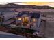 Aerial view of a backyard with a patio, fire pit, trampoline, and lush greenery at 6766 Mentha Dr, Castle Rock, CO 80108