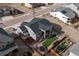 Aerial view showcasing an enclosed backyard with lawn, patio, trampoline, and outdoor seating at 6766 Mentha Dr, Castle Rock, CO 80108